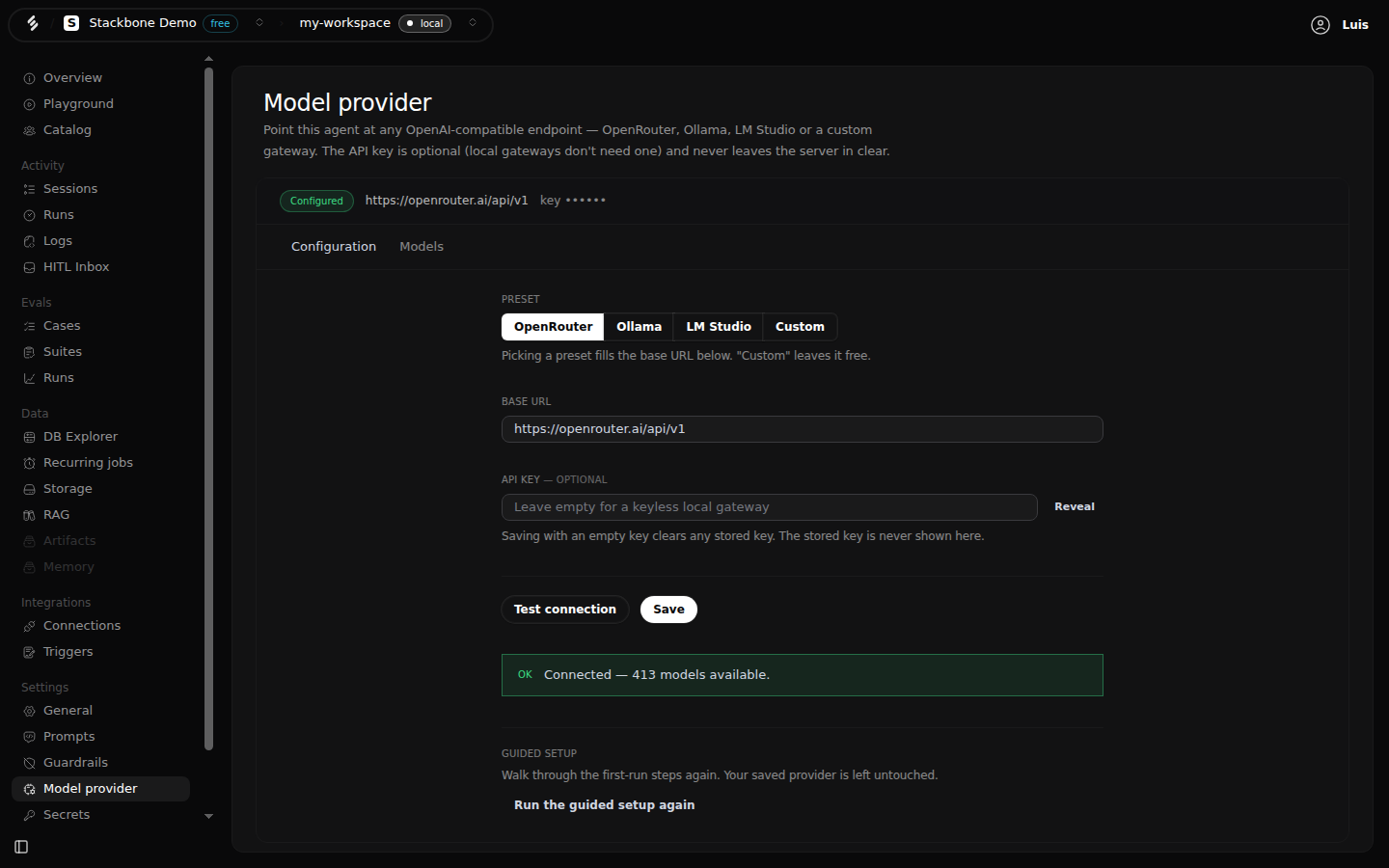 The Model provider screen in Studio, Configuration tab: the OpenRouter preset selected, the base URL https://openrouter.ai/api/v1, an empty optional API key field with a Reveal button, the Test connection and Save buttons, and a green result reading 
